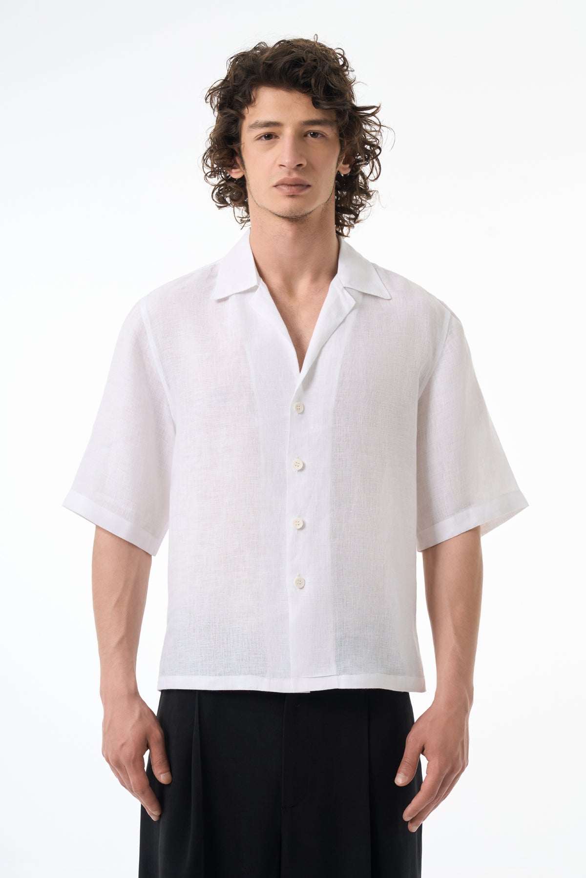Man wearing a white short-sleeve shirt on a white background