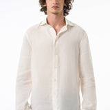Man wearing a white linen shirt on a white background